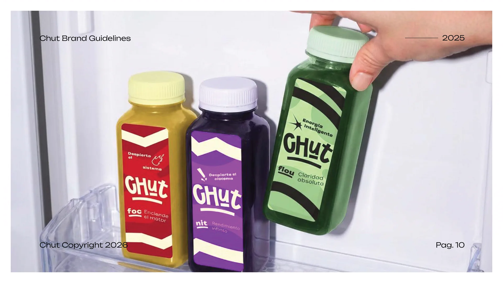 Hand taking a green Chut bottle from a fridge shelf holding yellow and purple bottles