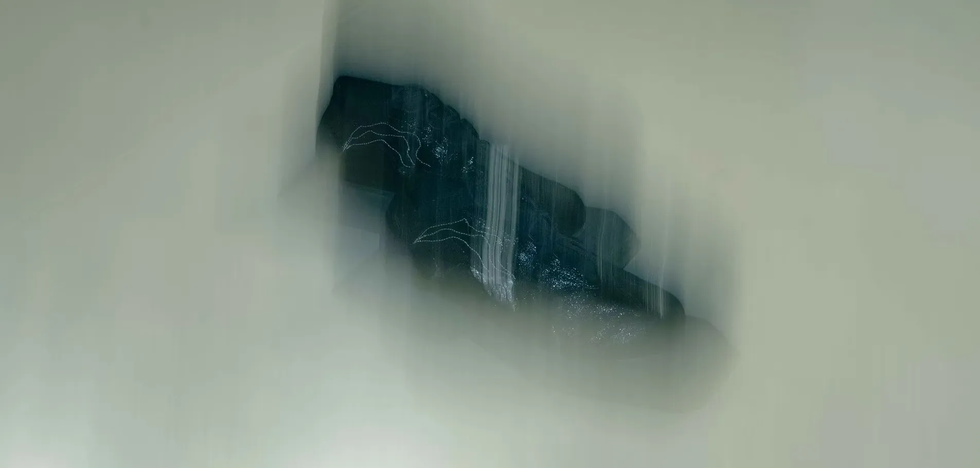 Motion-blurred studio shot of a black Oppressus platform sneaker